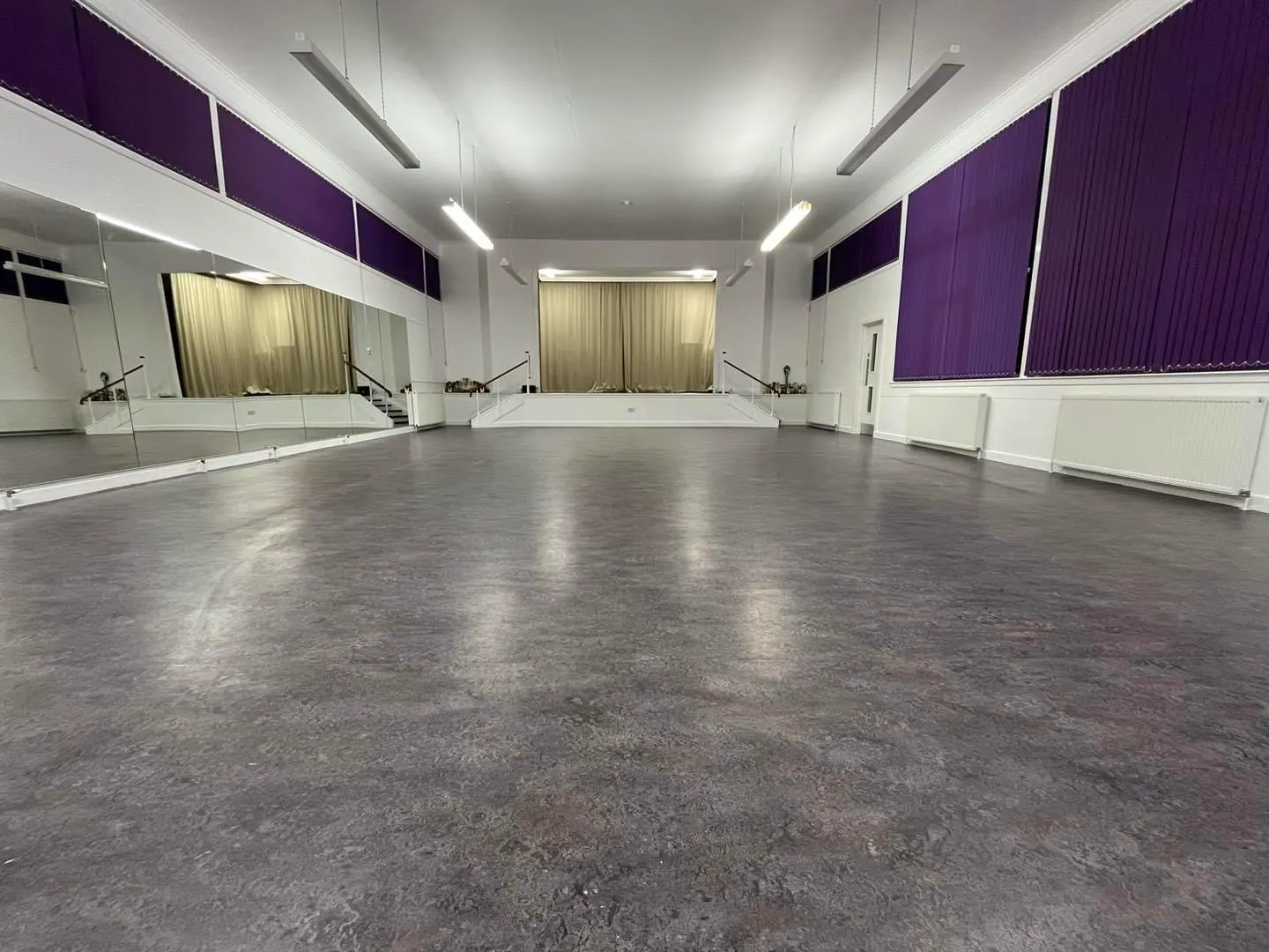The main hall: a bright studio with mirrors and a sprung floor