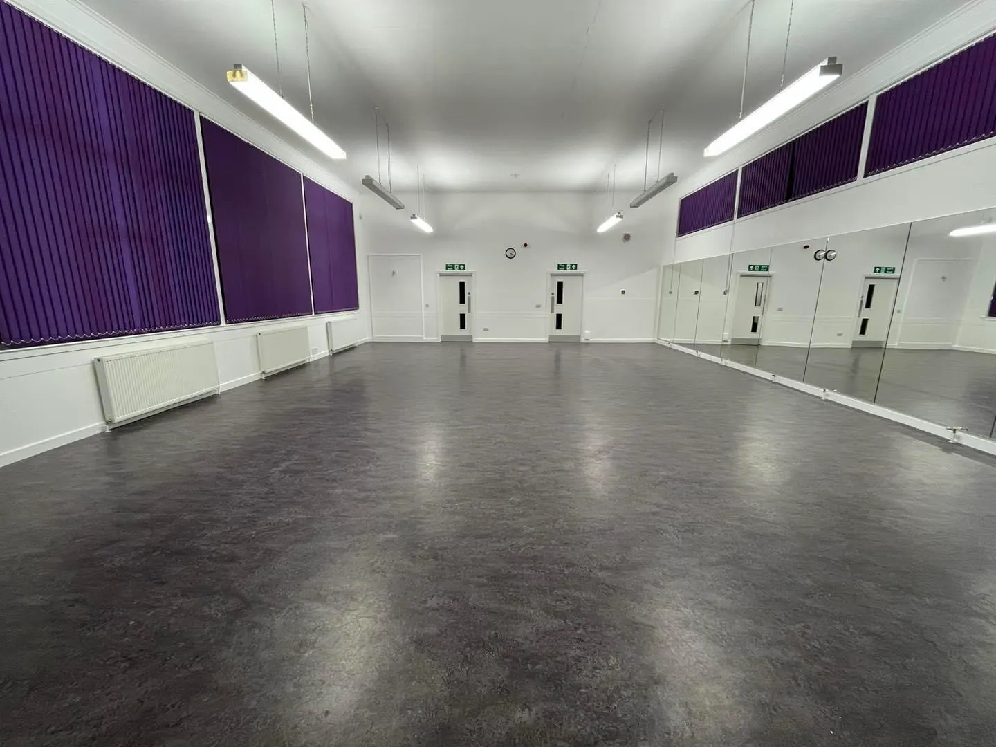The studio hall with purple acoustic panels and mirrors